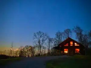 The fire pit has bistro-style lighting and sits just outside the cabin for kicking back and relaxing with family and friends.